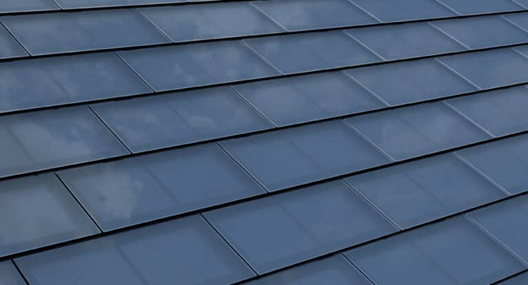 Solar Roof Shingles. Building-integrated photovoltaics system consisting of modern monocrystal black solar roof tiles.