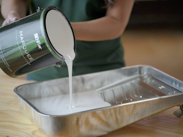 Pouring paint into a tray